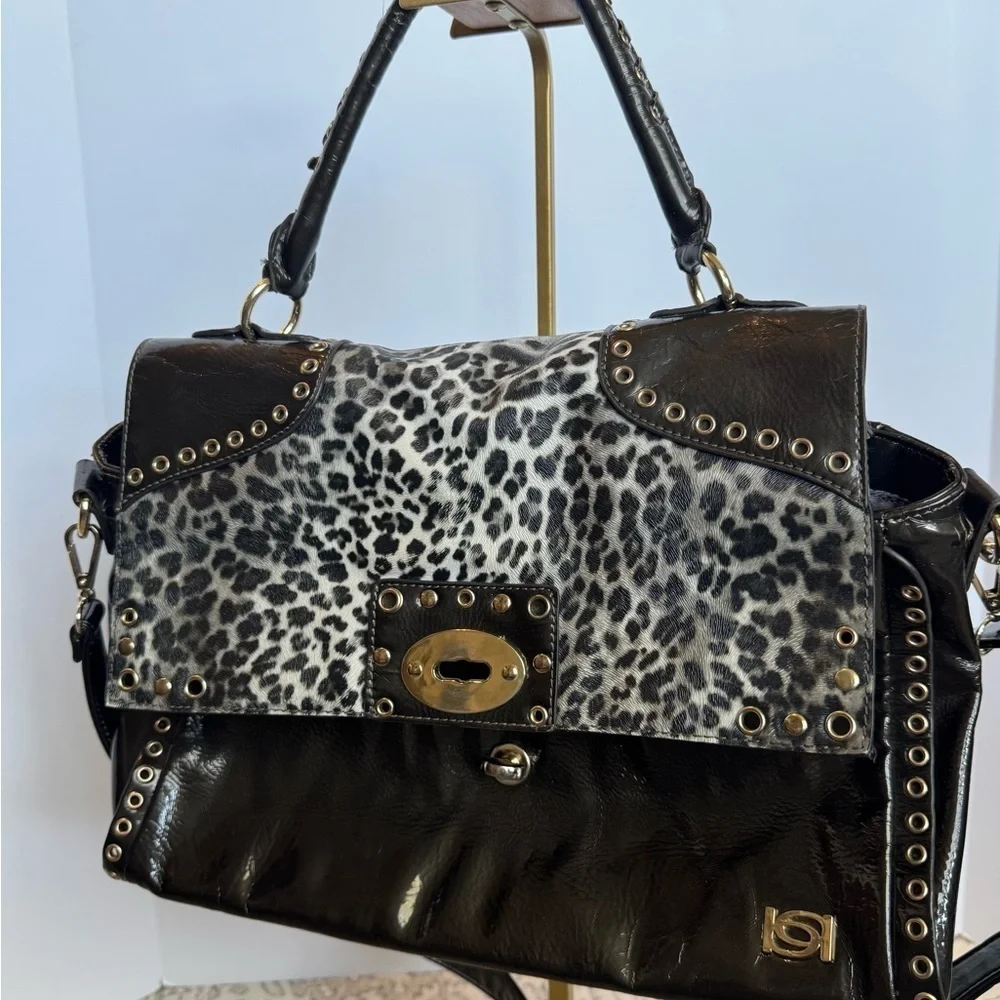 BEBE Large Handbag Leopard Grommet in Black and gray and gold